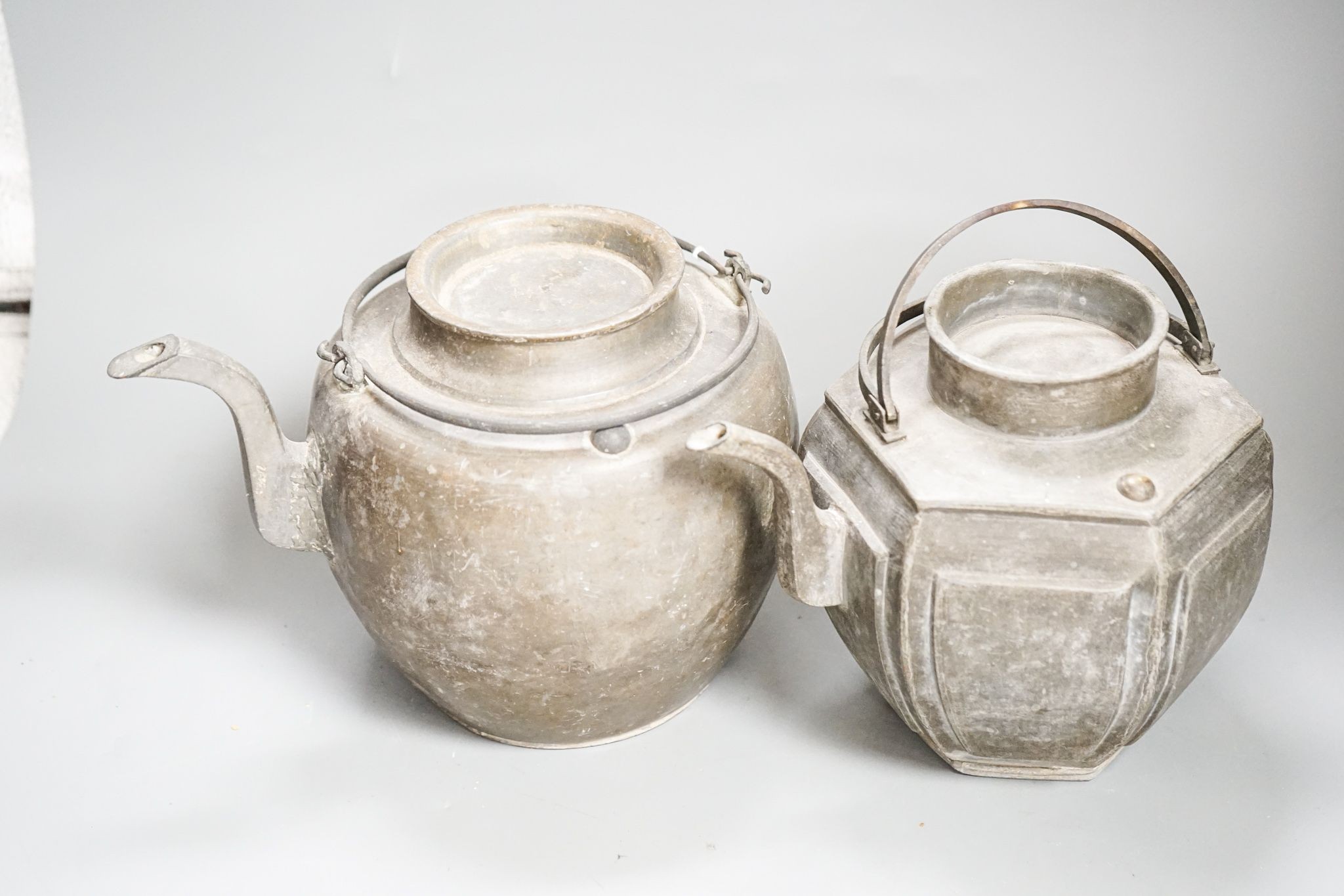 Two Chinese pewter teapots, late 19th/early 20th century, largest 23cm across